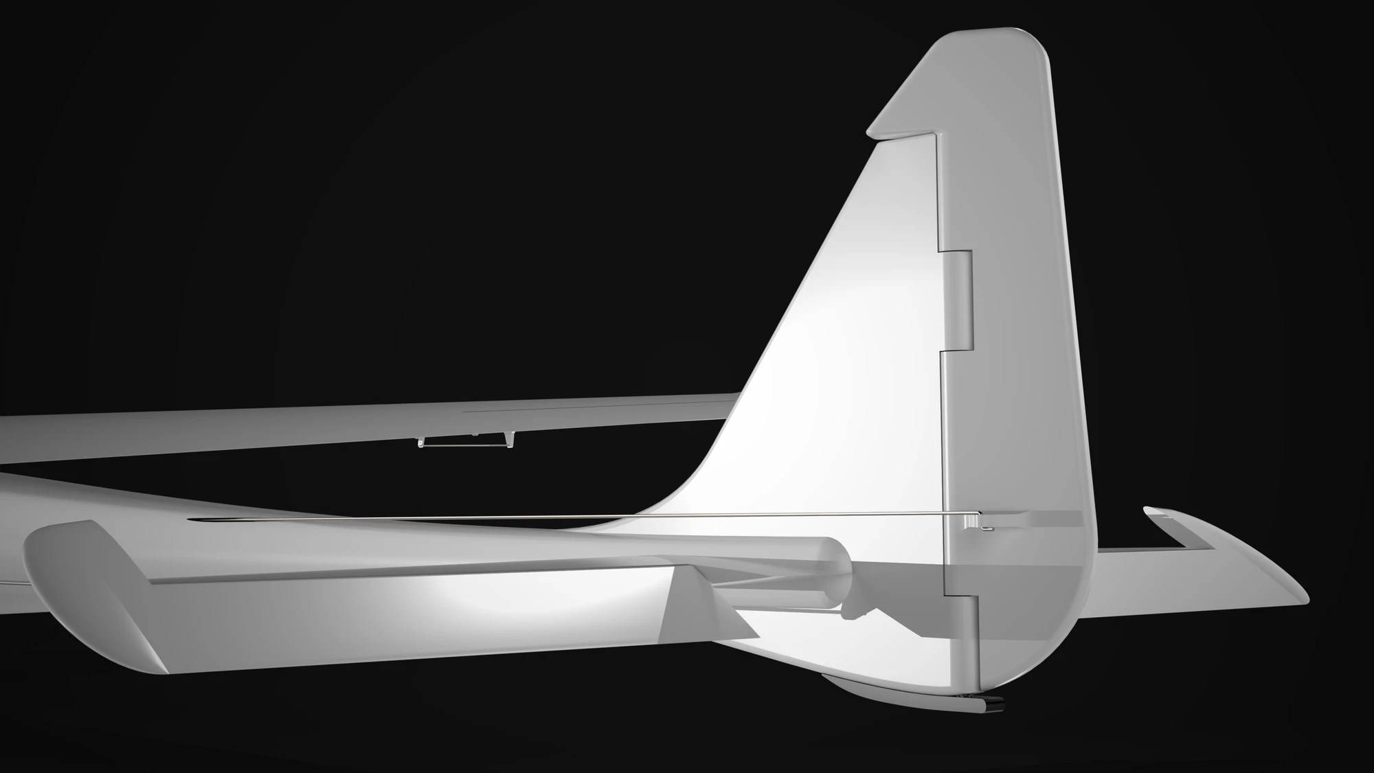 A close view of the tail rendered in white on black: the vertical fin with the rudder hinge line down its trailing edge, the horizontal stabiliser passing through below it, and a steel pushrod running forward along the boom.