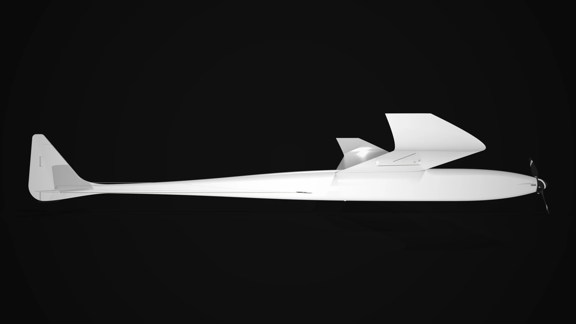The aircraft in side elevation, rendered in white on black: the propeller at the nose on the right, the wing meeting the fuselage at mid-length with its winglet rising behind it, and the fin and stabiliser at the left.