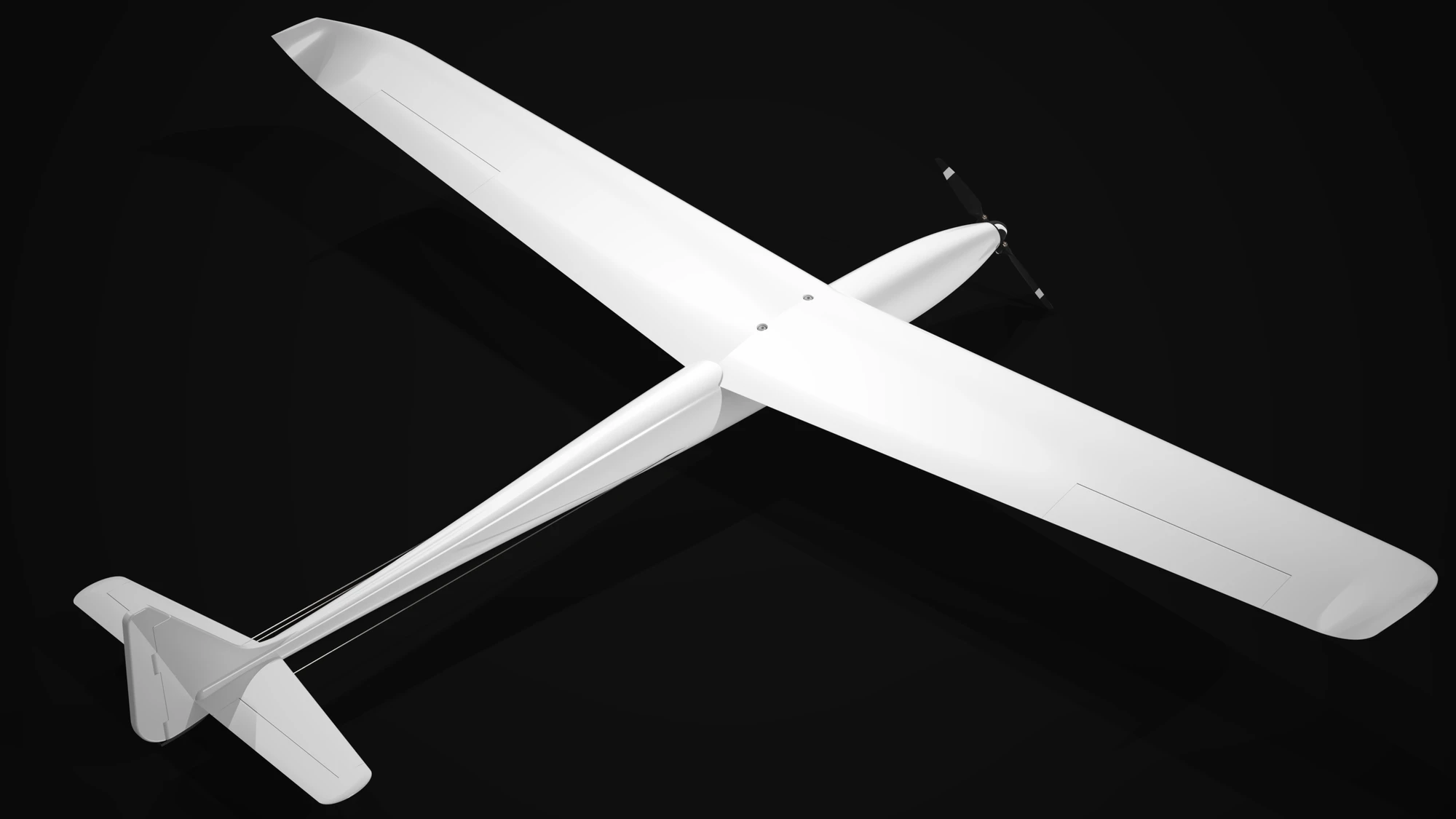 The finished v1 aircraft rendered in white on black, seen from above and ahead: a long straight high wing with upturned tips, a slender fuselage, a propeller at the nose and a conventional tail at the end of a narrow boom.