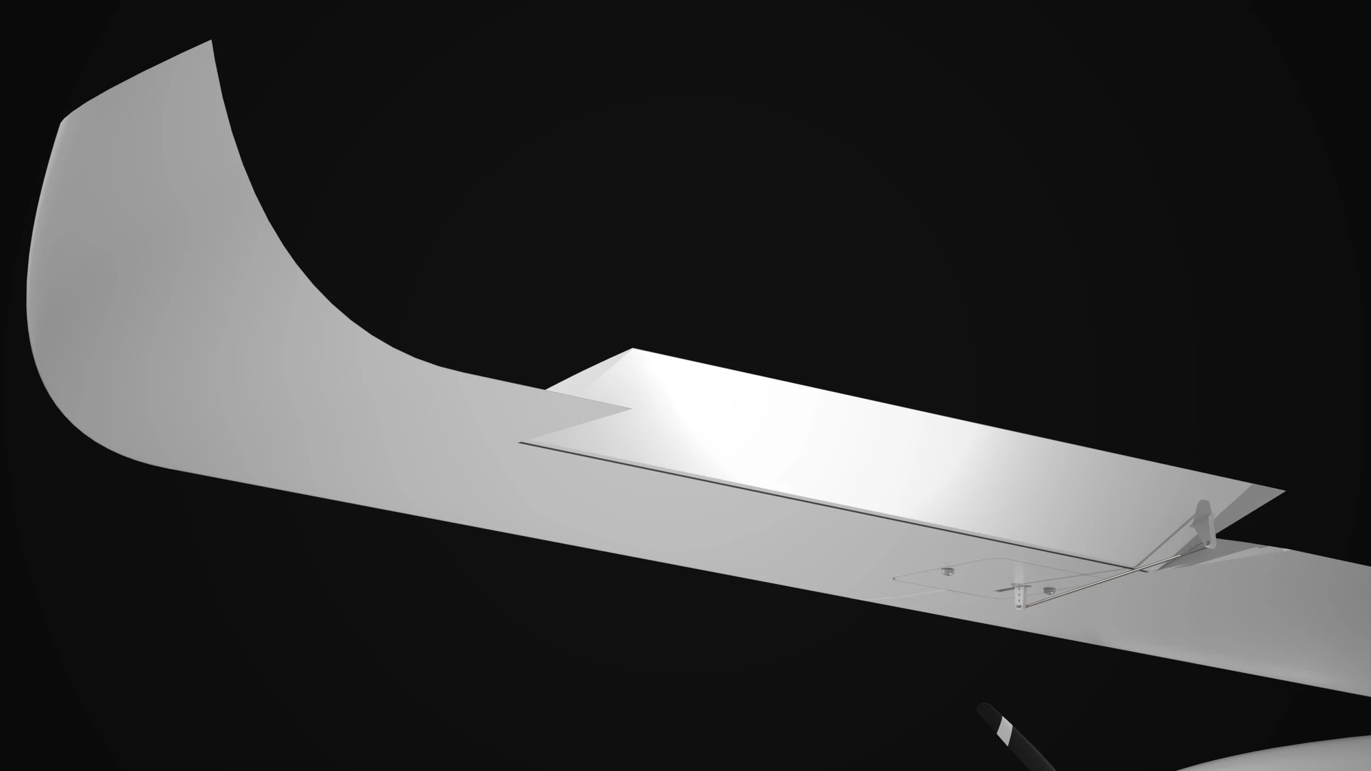 A close view of the wing tip rendered in white on black: the winglet curving up off the end of the wing, the aileron deflected upward on its hinge line, and a linkage running from a horn down into a recess in the wing surface.